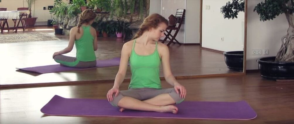 A girl is engaged in physical therapy for the treatment of cervical osteochondrosis.